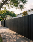 Black exterior wall panels on a contemporary home facade.