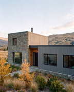 Grey composite cladding on an alpine home exterior.