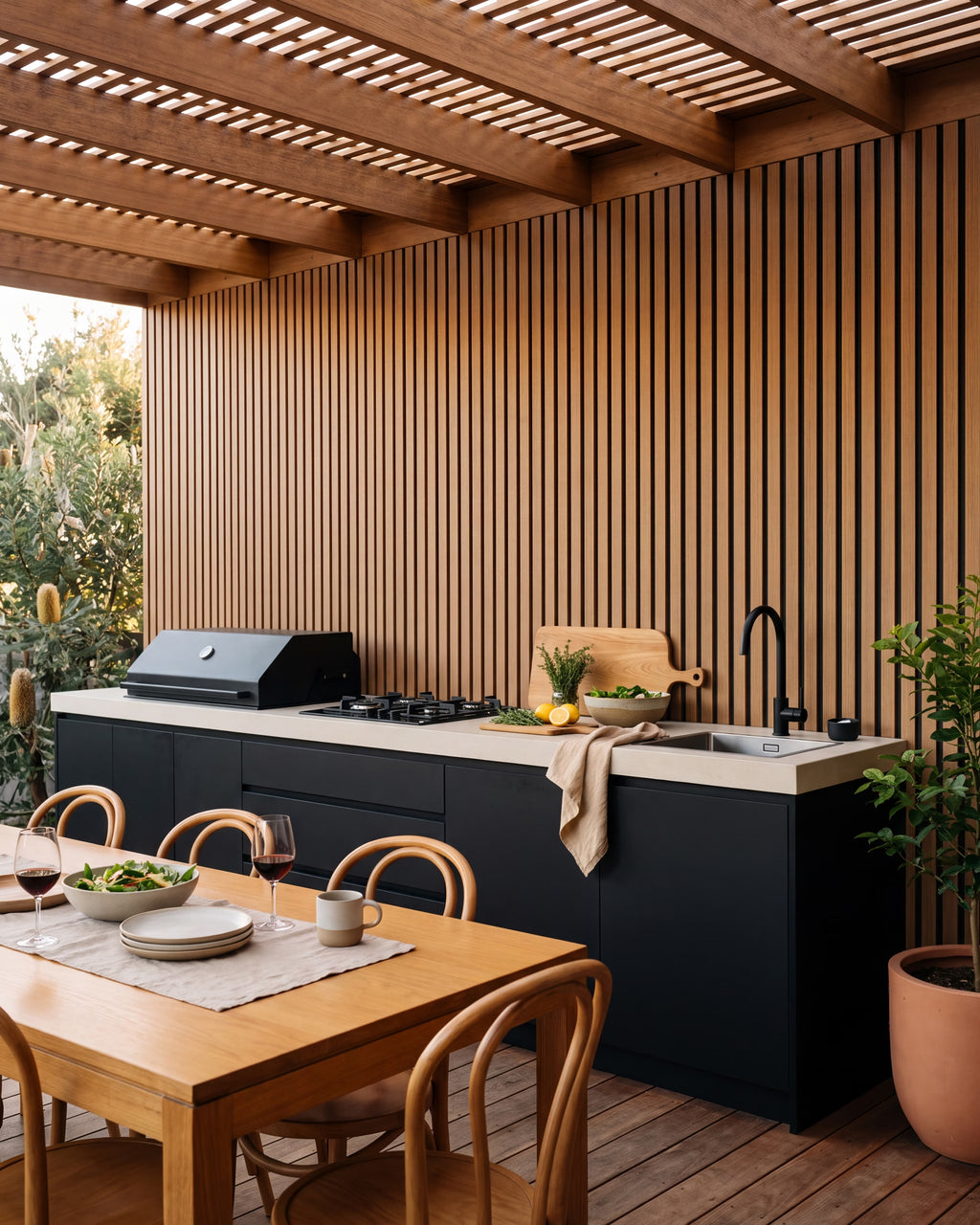 Oak wood-look wall panels behind a covered outdoor kitchen.