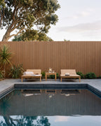 Oak composite wall panels used as a swimming pool fence.