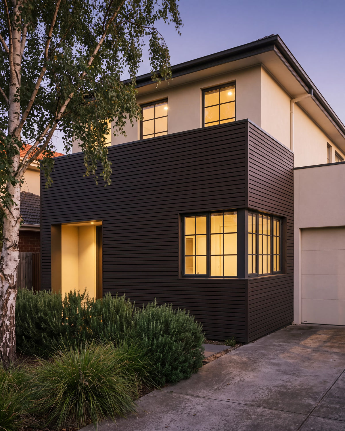 Walnut composite wood wall panels across a modern house facade.